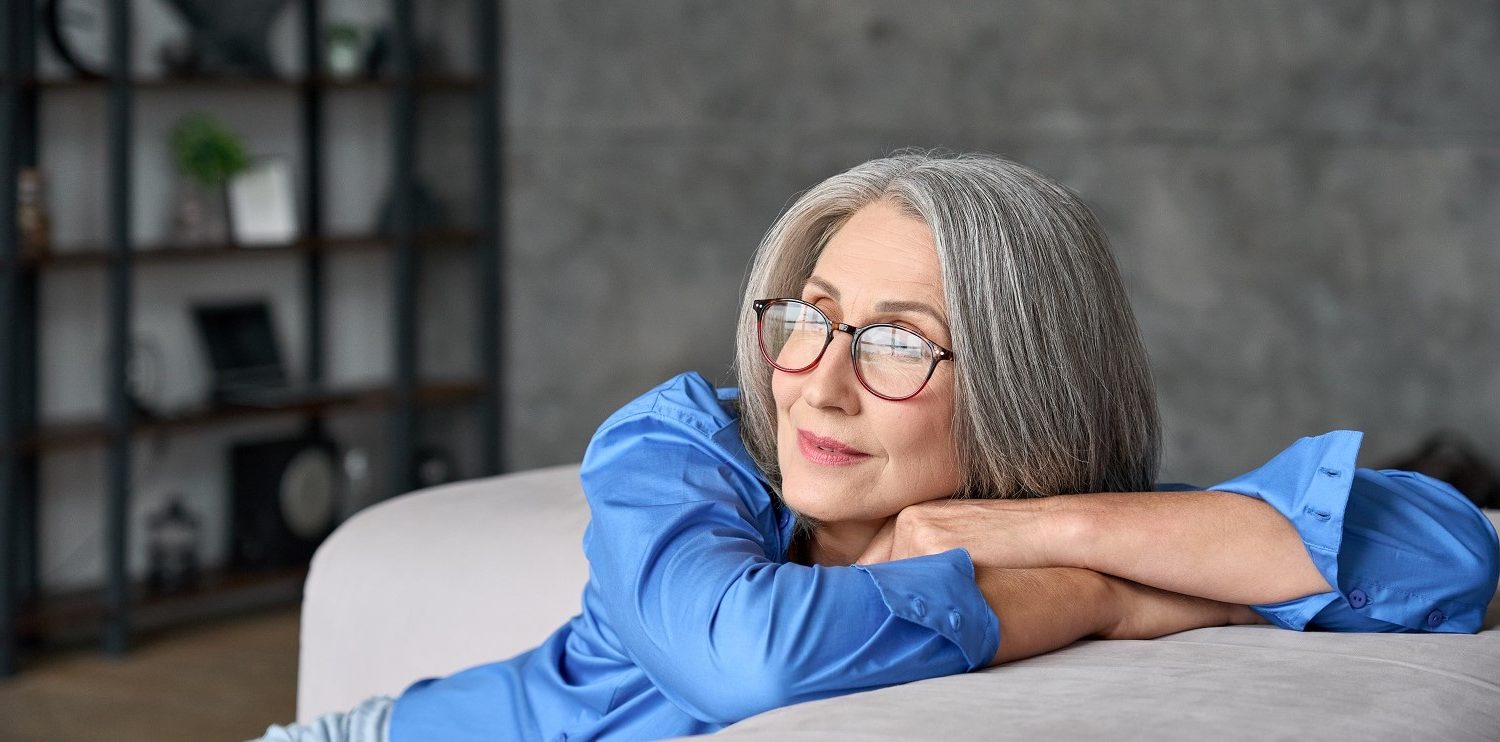 older woman looking reflective and peaceful